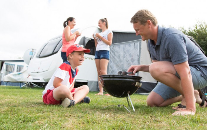 For this tourism photography project Tony wanted to involve happy campers in the foreground and background. He found a lovely family of “model campers” on the site in Cornwall.