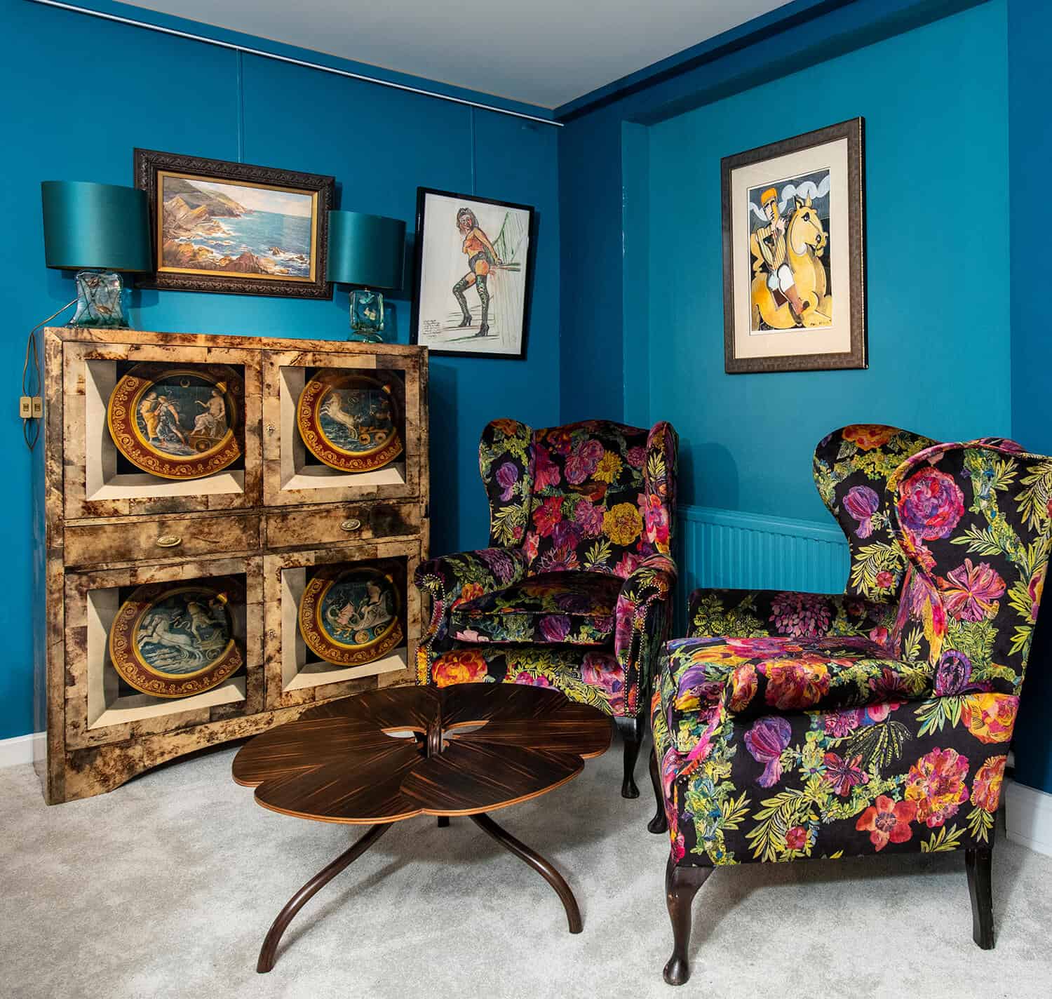 Interior photograph of antiques showroom with colourful chairs