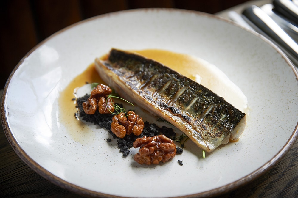 Natural light and shallow depth of field draws your eye to the freshly cooked sheen on this dish.