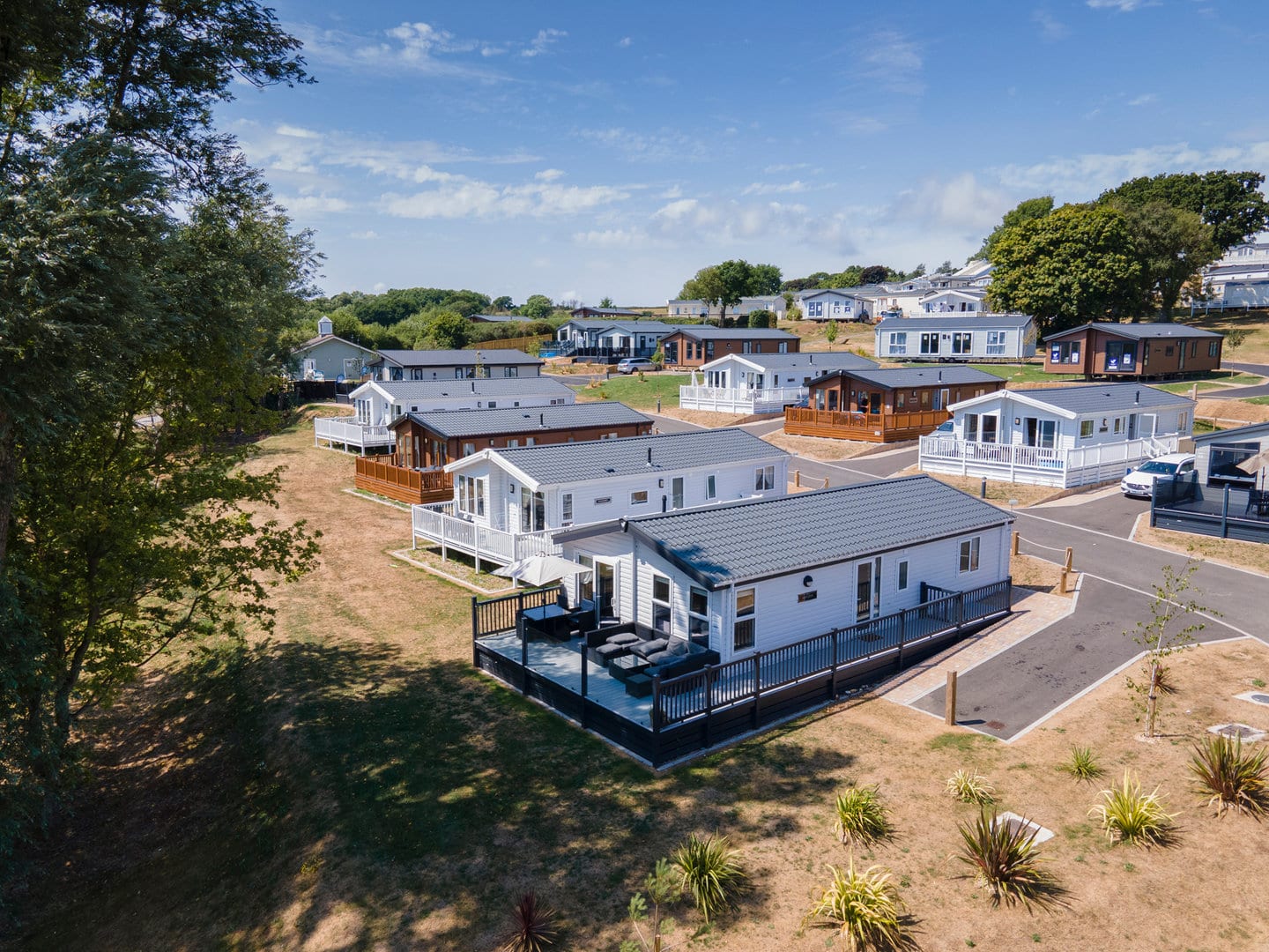 Close up drone photograph of a holiday park showcasing the accommodation in detail 